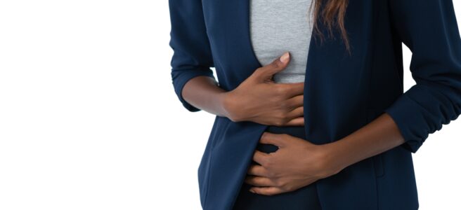 Woman holding stomach in pain